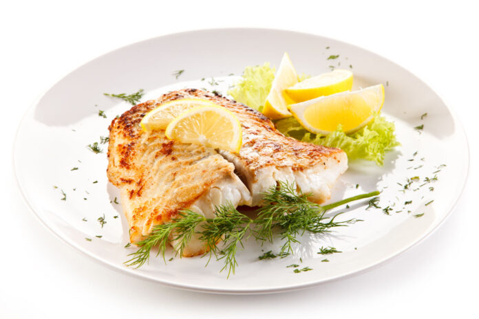 51603483 - fish dish - fried fish fillet and vegetables